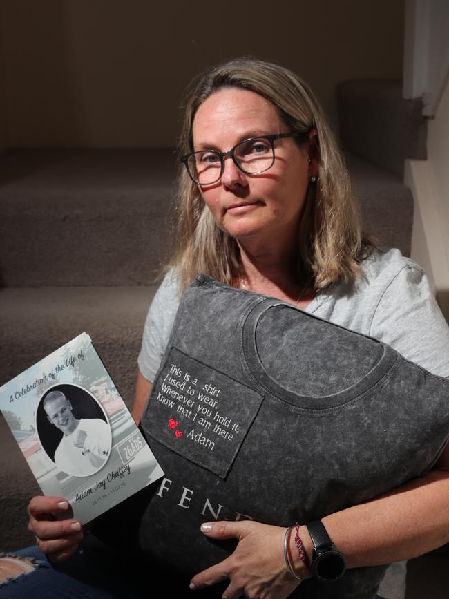 Karen at her Ashmore home, hugging a pillow made out of her sons shirt. Picture Glenn Hampson