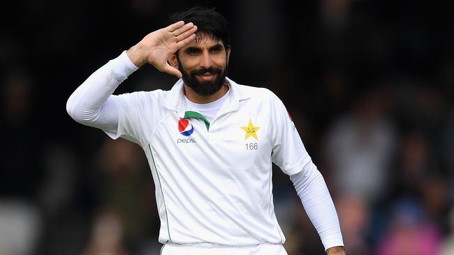 Pakistan captain Misbah-ul-Haq salutes his national flag after scoring a century at Lord’s.