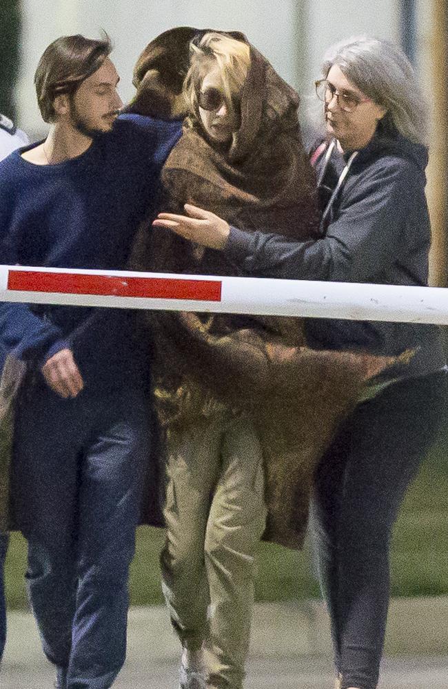 Hannah Quinn is wrapped in a blanket as she leaves Silverwater Jail with her family after being granted bail yesterday. Picture: Damian Shaw