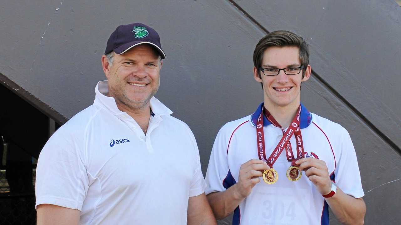 THAT'S GOLD: Toowoomba's Mason Hughes (right) celebrates school state title success with coach Justin Anlezark. Anlezark has high praise for Sports Darling Downs and the group's passion for advancing sport in the region. Picture: CONTRIBUTED