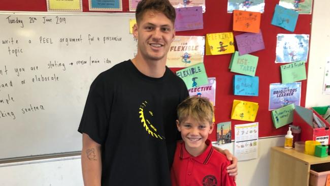 Kalyn Ponga with a starstruck Ollie Daniels in his classroom.