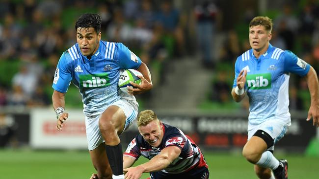 Rieko Ioane of the Blues avoids a tackle to score a try at AAMI Park in Melbourne.