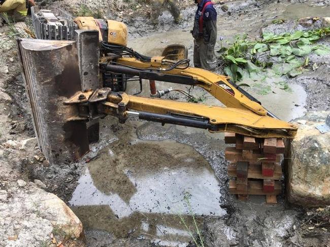 The man was pinned by the excavator. Picture: Facebook/ Fire and Rescue 295 Forster