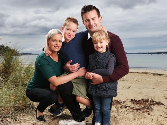 Dean Winter with wife Allison and children George, 5, and Harriet, 3, at Kingston Beach. Picture: Nikki Davis-Jones