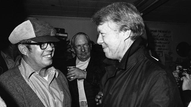 President-elect Jimmy Carter consoles brother Billy Carter (left) after Billy loses the 1976 race for mayor of Plains, Georgia. Picture: AP/Charles W. Harrity