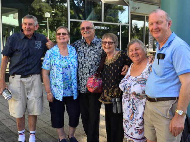 Fraud victim Robert Sullivan (left) with Cheryl Linderman, the daughter of another victim Henry Wall, and her family outside Gosford District Court after the sentencing of Aruna Gould. Picture: Richard Noone