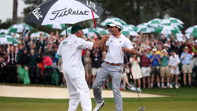 Adam Scott celebrates with caddie Steve Williams in 2013 (Photo by Andrew Redington/Getty Images)