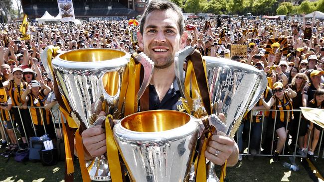 Luke Hodge with three of his four Hawthorn premiership cups. Picture: Michael Klein