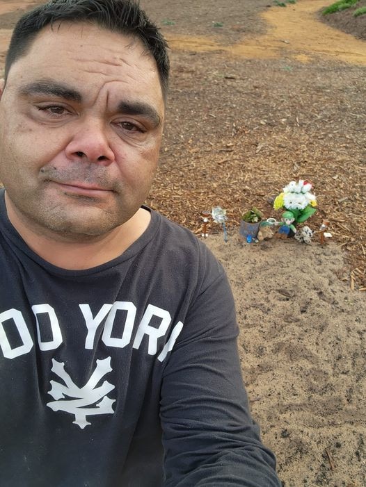 Shane Wanganeen at the gravesite of his son Makai Wanganeen at Smithfield cemetery. Picture: Supplied