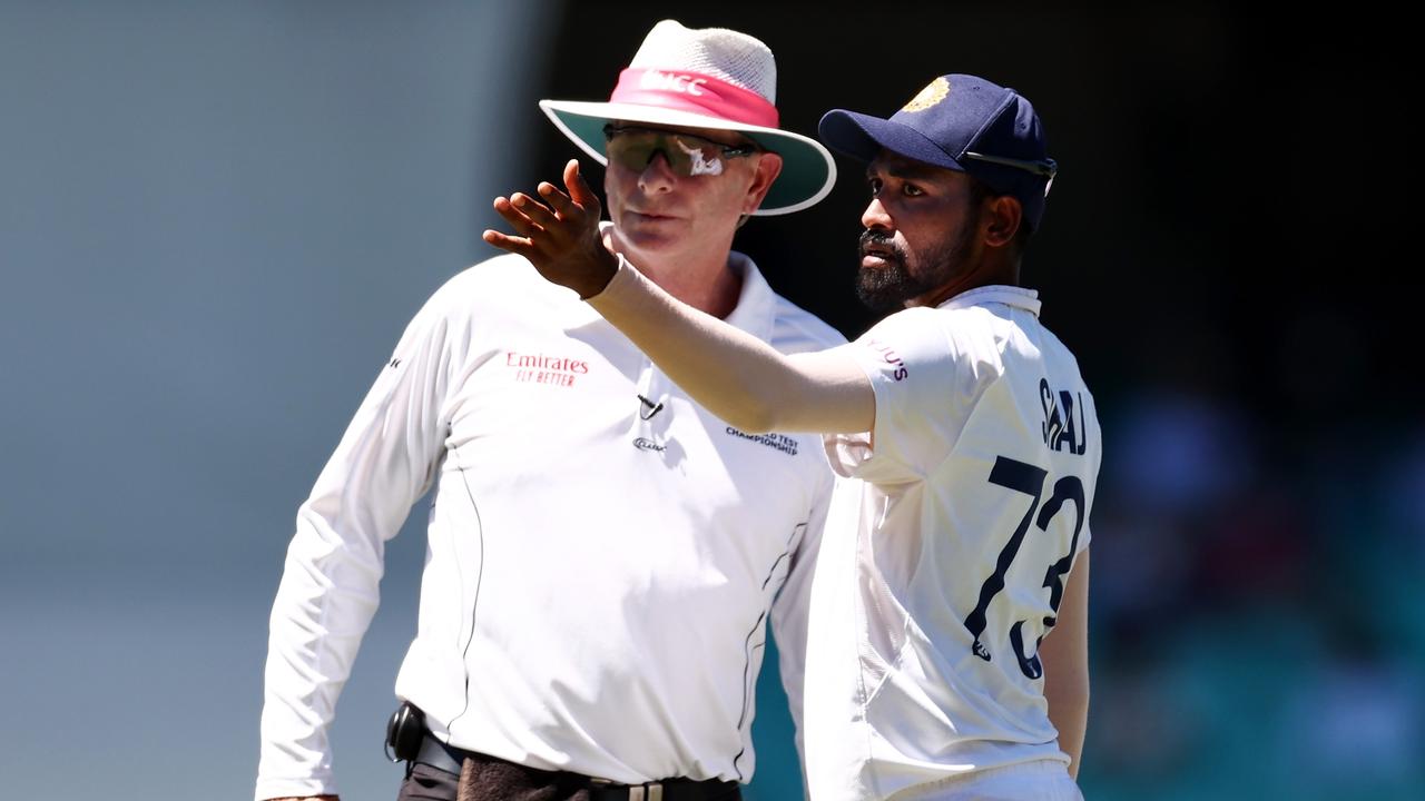 Mohammed Siraj stops play to make a formal complaint to Umpire Paul Reiffel about some spectators on day four of the third Test. (Photo by Cameron Spencer/Getty Images)