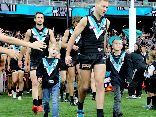 The Cornes boys during Kane’s final AFL game in 2015.