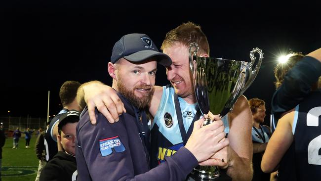 Daniel Willing (left), pictured celebrating the 2019 SFL premiership with Lindisfarne captain Michael Cassidy, has been appointed senior coach at Lauderdale. Picture: NIKKI DAVIS-JONES