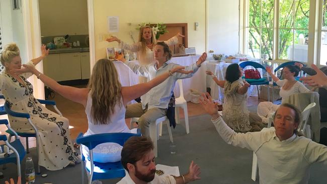 A shot taken from the group’s website shows believers in meditation. Picture: Supplied