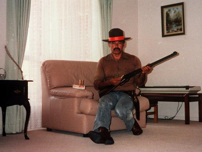 Backpacker Killer Ivan Milat posing as a cowboy in his home.