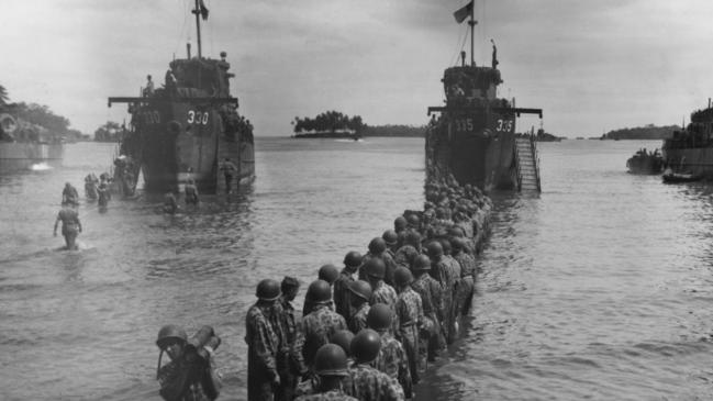 US Marines pass munitions from three landing craft carriers on to the shore during the seizure of Rendova Island in the Solomon Islands, mid 1940s. Picture: Getty Images