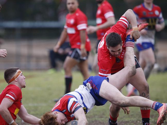 Emu Plains winger Jack Babbage meets his match. Picture Warren Gannon Photography