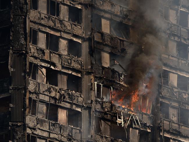 Debris falls from the burning 24 storey residential Grenfell Tower block in London. Photo: Chris J Ratcliffe/Getty Images