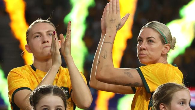 MELBOURNE, AUSTRALIA - FEBRUARY 28: Clare Hunt of Australia and Alanna Kennedy of Australia thank the crowd before the AFC Women's Olympic Football Tournament Paris 2024 Asian Qualifier Round 3 match between Australia Matildas and Uzbekistan at Marvel Stadium on February 28, 2024 in Melbourne, Australia. (Photo by Robert Cianflone/Getty Images)