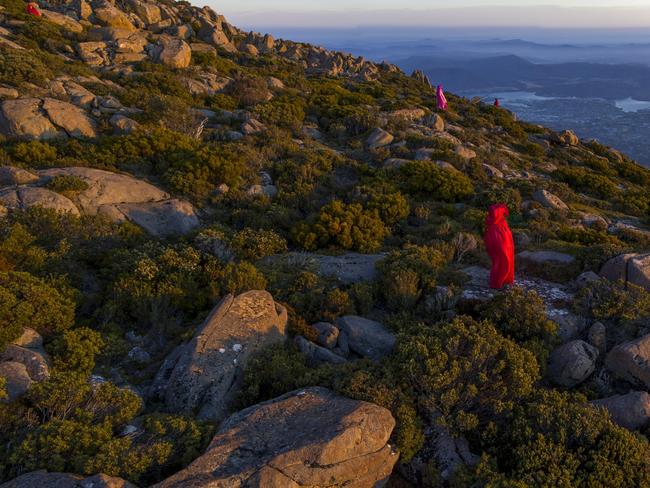 Sentinels from Residents Opposed to the Cable Car positioned at the outline of the proposed Pinnacle Centre on Mt Wellington, Tasmania at sunrise on Monday, January 6, 2020.