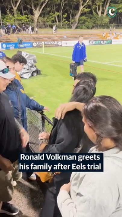 Ronald Volkman greets his family after Eels trial