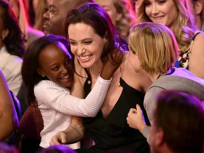 Actress Angelina Jolie hugs her daughters Zahara and Shiloh at Nickelodeon's 28th Annual Kids' Choice Awards in California last year. Picture: Kevin Winter/Getty Images