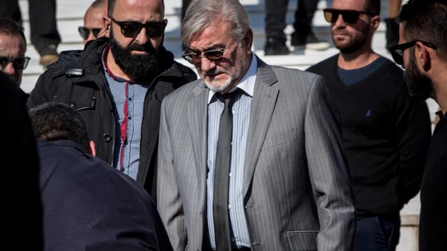 Stelios Macris at the funeral of his son in Athens. Picture: Angelo Christofilopoulos