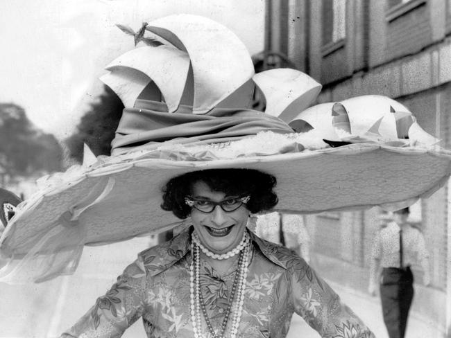 Comedian and actor Barry Humphries wears a hat featuring the Opera House at Royal Ascot in England, 1976. Picture: News Corp Australia