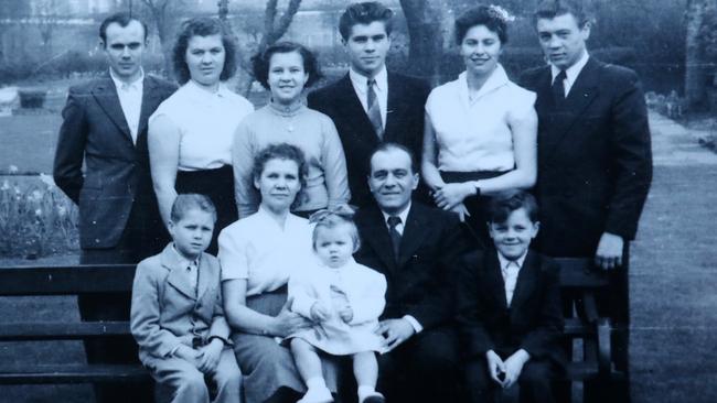 Vili (bottom right) as a child with his family in England. Picture: Supplied