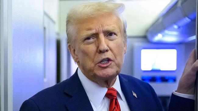 US President Donald Trump speaks to reporters while in flight on Air Force One en route Joint Base Andrews in Maryland on January 27, 2025. (Photo by Mandel NGAN / AFP)