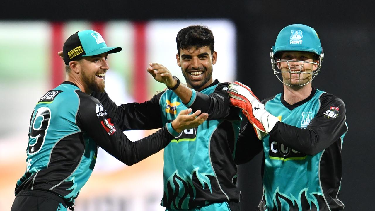 Shadab Khan (centre) of the Heat celebrates with Alex Ross (left) and Jimmy Peirson (right) after getting the wicket of Glenn Maxwell of the Stars during the Big Bash League (BBL) cricket match between the Brisbane Heat and the Melbourne Stars at the Gabba in Brisbane, Wednesday, December 20, 2017. (AAP Image/Darren England) NO ARCHIVING, EDITORIAL USE ONLY.