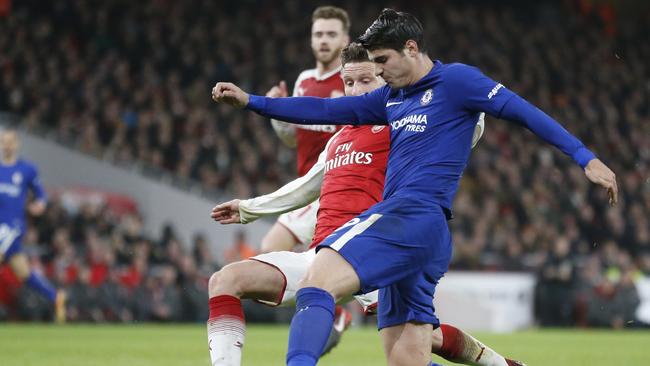 Chelsea's Alvaro Morata vies for the ball with Arsenal's Shkodran Mustafi.