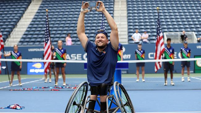 Dylan Alcott celebrates with the championship trophy in New York after defeating Niels Vink of The Netherlands to complete a historic golden slam. Picture: Getty Images