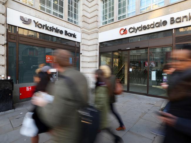 Pedestrians pass branches of Clydesdale Bank Plc and Yorkshire Bank Plc, owned and operated by National Australia Bank Ltd., in London, U.K., on Tuesday, Jan. 19, 2016. National Australia Bank Ltd. set an initial public offering price range for CYBG Plc, its U.K. unit -- known to its customers as Clydesdale Bank and Yorkshire Bank -- that values CYBG at as much as 2.07 billion pounds ($2.95 billion) and advances its plan to exit the market. Photographer: Chris Ratcliffe/Bloomberg