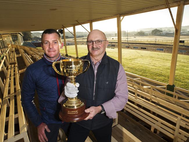 Trainers Adam Trinder and Michael Trinder with the Melbourne Cup at Spreyton. PICTURE CHRIS KIDD