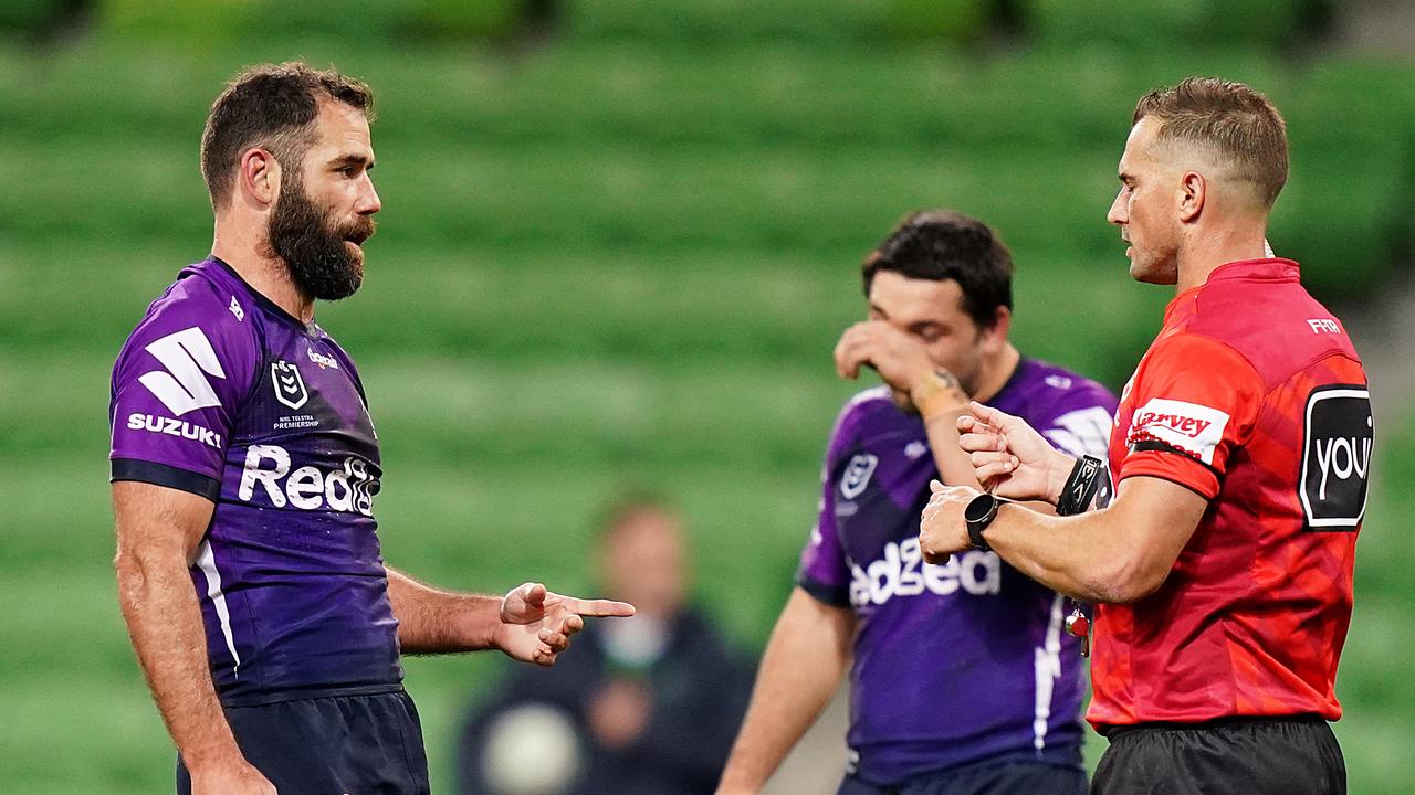 Cameron Smith of the Storm speaks with the referee during the Round 3 NRL match between the Melbourne Storm and the Canberra Raiders