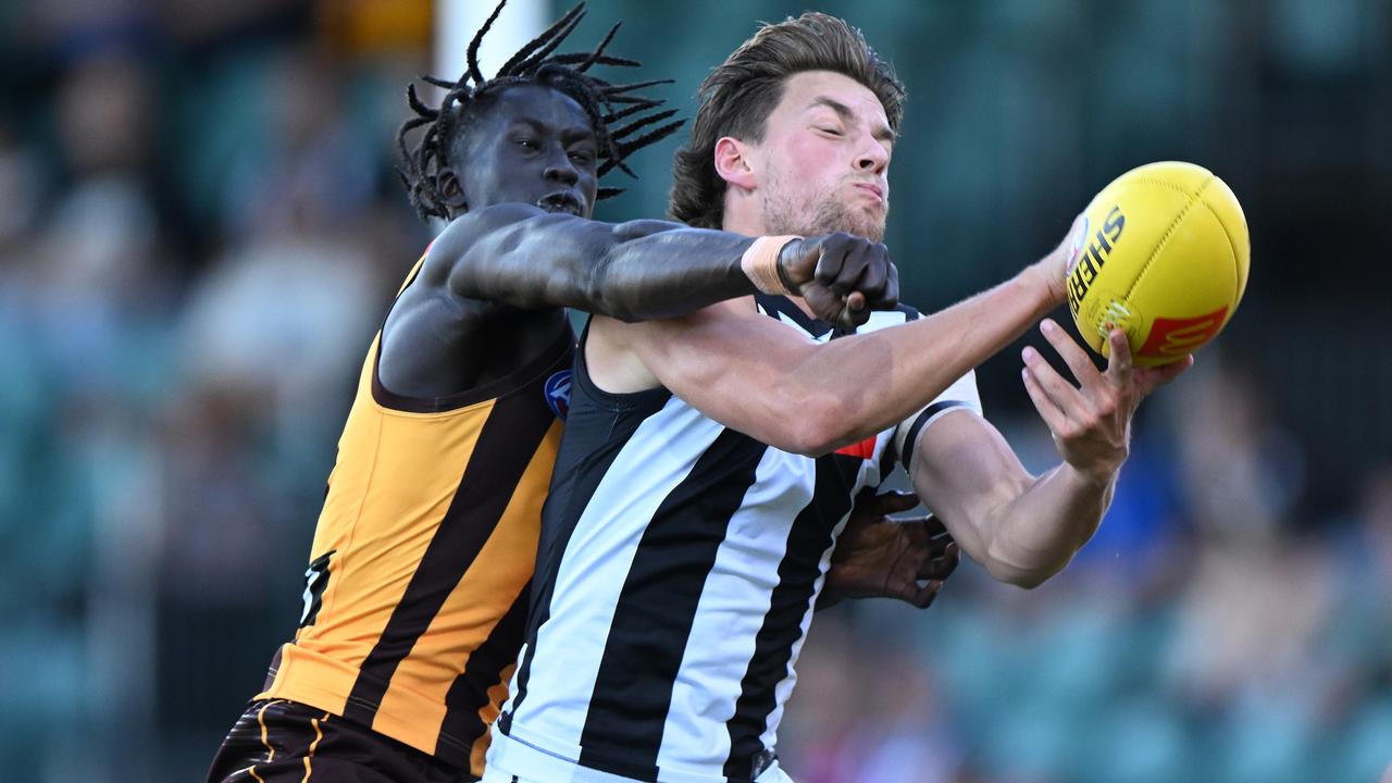 Adelaide, Australia. 03rd June, 2023. Conor Nash of the Hawks is tackled by  Dan Houston and Riley Bonner of the Power during the AFL Round 12 match  between the Port Adelaide Power