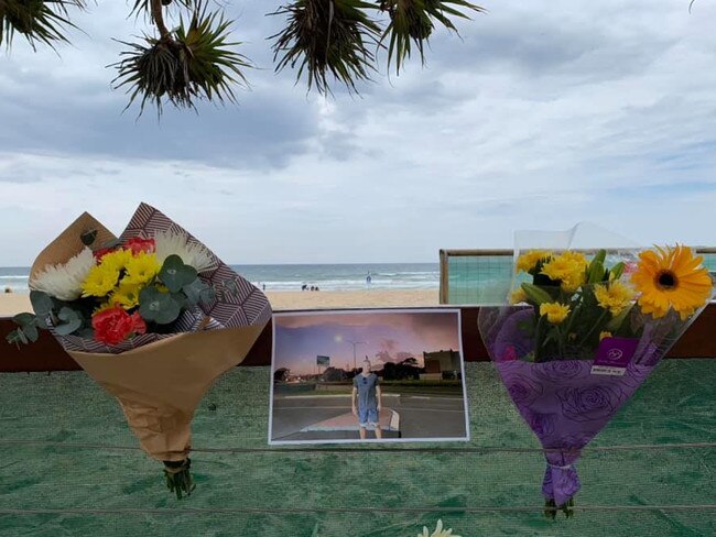 Friends farewelled Nick Slater during an intimate paddle out at Burleigh Heads last year. Picture: Laurie Minto