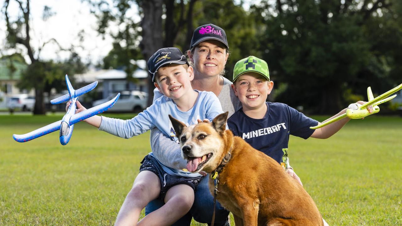 Rebecca Bridge with her sons Bradley (left) and James and their dog Jacey during Mother's Day celebrations in the Queensland State Rose Garden, Newtown Park, Sunday, May 8, 2022. Picture: Kevin Farmer