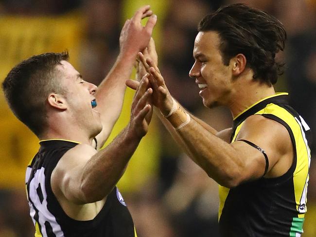 MELBOURNE, AUSTRALIA - JUNE 28:  Daniel Rioli of the Tigers celebrates after kicking a goal with Jack Higgins of the Tigers  during the round 15 AFL match between the Richmond Tigers and the Sydney Swans at Etihad Stadium on June 28, 2018 in Melbourne, Australia.  (Photo by Scott Barbour/Getty Images)