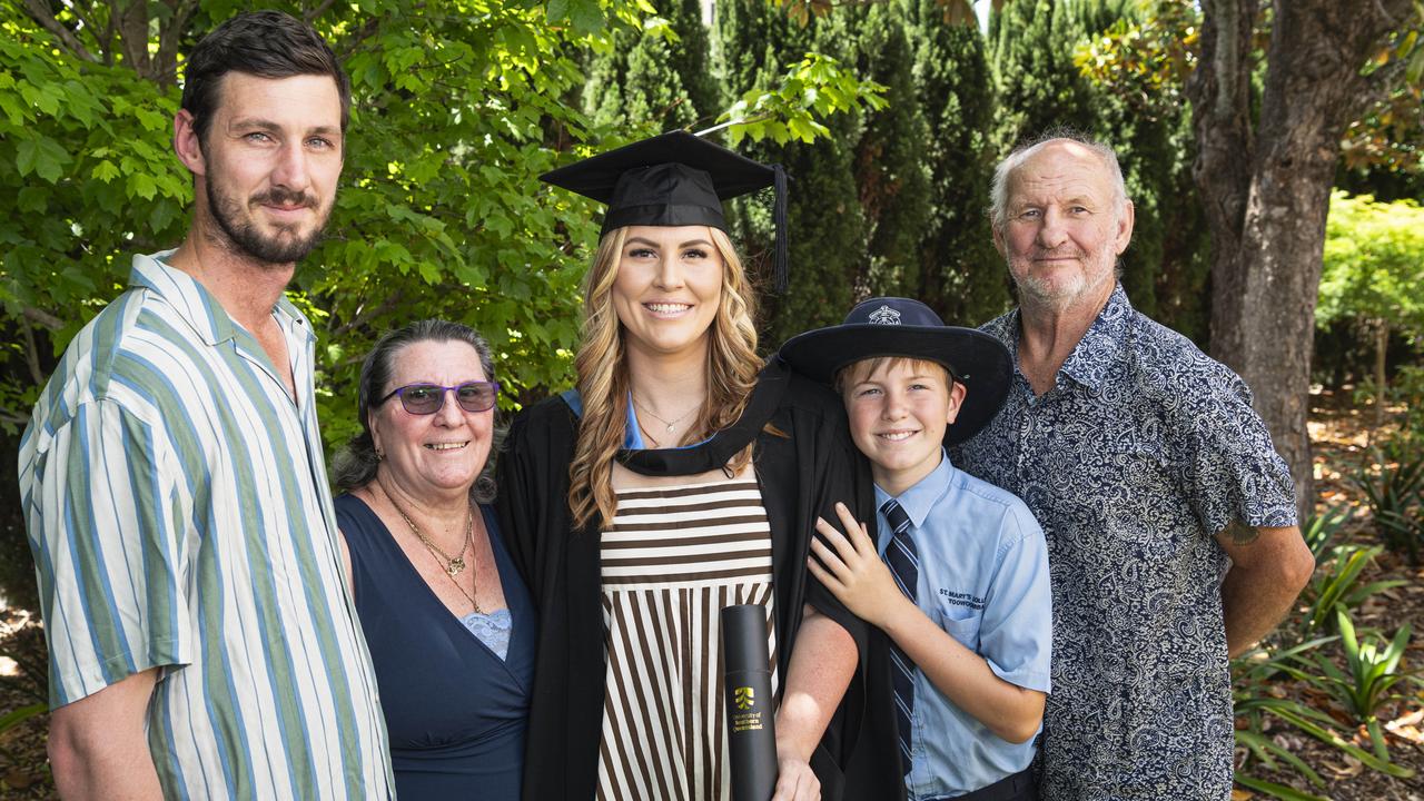 Bachelor of Nursing graduate Kimberlee Wilson with family (from left) William Mitchell, Mary-Ann Wilson, CJ Quick and Thomas Wilson at a UniSQ graduation ceremony at The Empire, Tuesday, October 29, 2024. Picture: Kevin Farmer