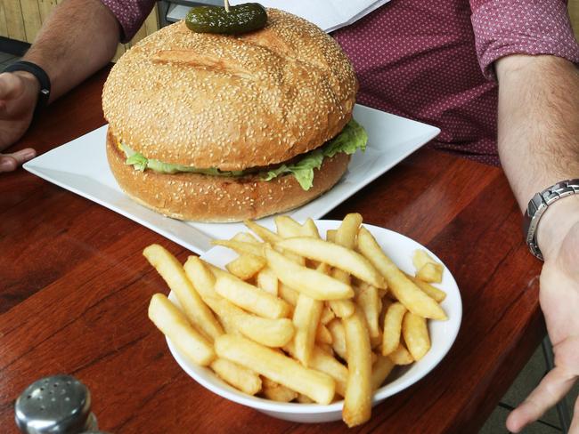 Patrons get to eat free if they can finish this giant burger in 30 minutes. Picture: Mark Wilson