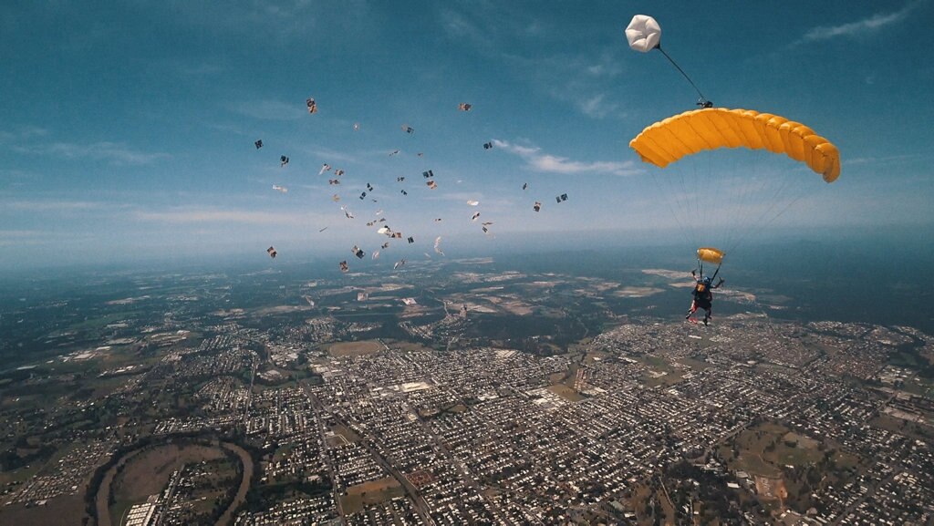 Brisbane radio host Stav Davidson dropped $10,000 in $5 notes during a skydive. Picture: Contributed