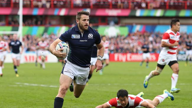 GLOUCESTER, ENGLAND - SEPTEMBER 23: Tommy Seymour of Scotland goes over to score his teams third try during the 2015 Rugby World Cup Pool B match between Scotland and Japan at Kingsholm Stadium on September 23, 2015 in Gloucester, United Kingdom. (Photo by Ben Hoskins/Getty Images)