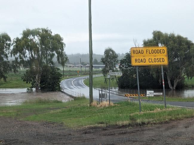 The cascade of rain in Warwick overnight has seen the Condamine River rise over the bridge at Rosehill Rd. Photo: Michael Hudson