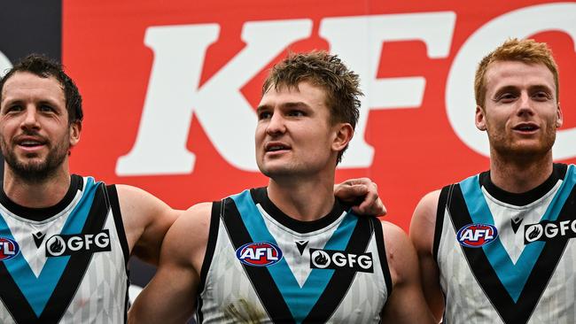 Ollie Wines with Travis Boak and Willem Drew. Picture: Daniel Carson/AFL Photos via Getty Images