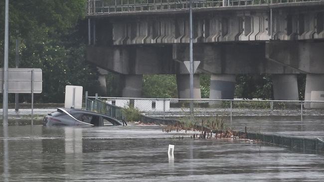 Flooding on the Gold coast in the aftermath of Cyclone Alfred. Car involved in water rescue at Yatala. Picture Glenn Hampson