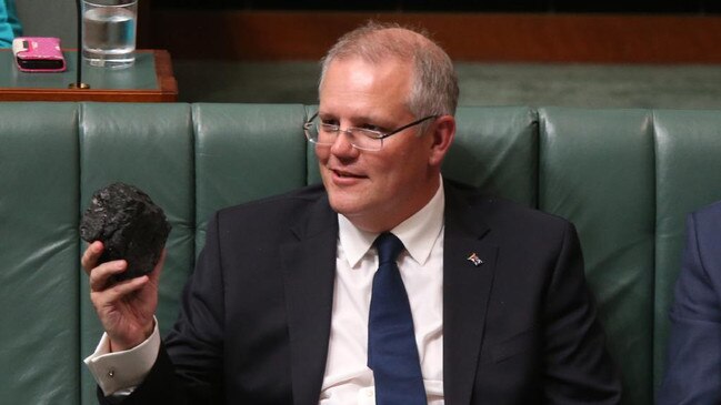 Prime Minister Scott Morrison with a lump of coal in parliament.