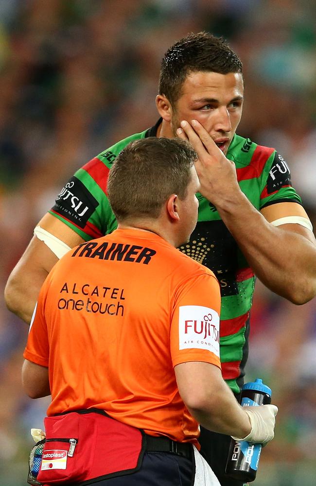 Sam Burgess receives treatment on a suspected broken cheekbone.