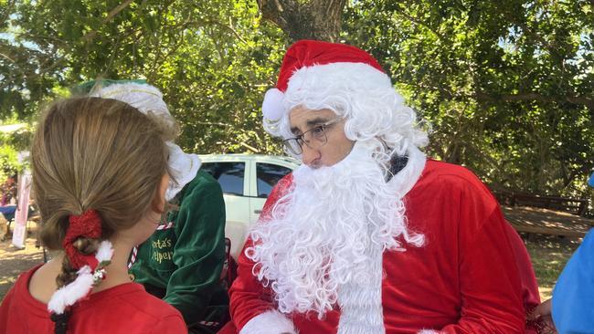 Father Christmas explaining the temperature difference between the Top End and the North Pole.