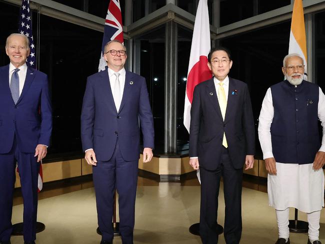 (L to R) US President Joe Biden, Australia's Prime Minister Anthony Albanese, Japan's Prime Minister Fumio Kishida and India's Prime Minister Narendra Modi pose for a photo as they hold a "Quad" meeting on the sidelines of the G7 Summit Leaders' Meeting on May 20, 2023. (Photo by JAPAN POOL / JIJI PRESS / AFP) / Japan OUT